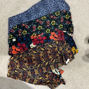 4 pairs of Lularoe Tall and Curvy leggings.